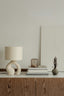 a lamp and books on a table